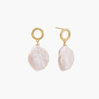 18K gold vermeil twisted circle studs with organic white baroque pearl drops on cream background