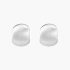 Brushed sterling silver cushion-shaped stud earrings with matte finish on white background