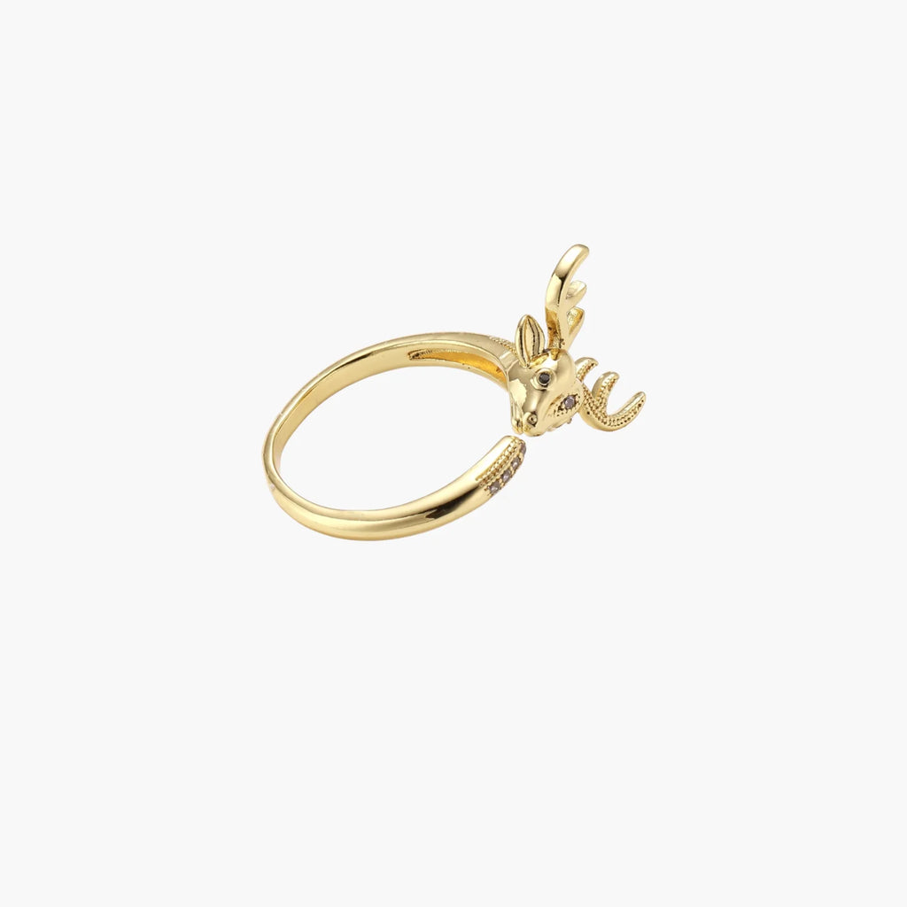 Gold-plated adjustable ring featuring 3D deer head with detailed antlers and cubic zirconia accents on cream background