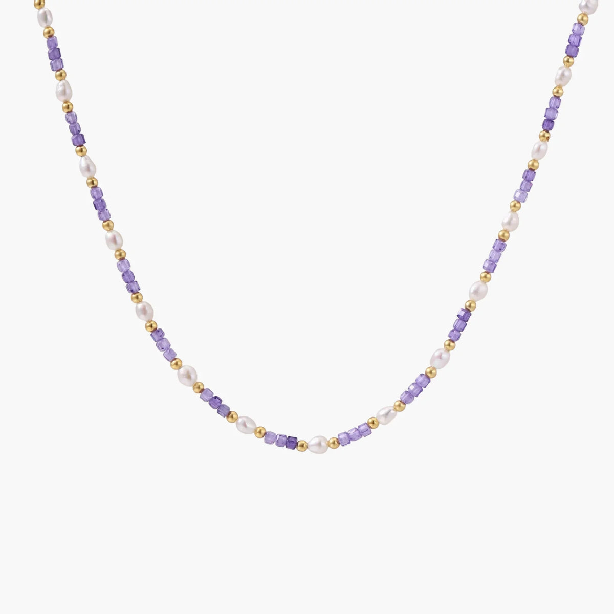 Delicate 18K gold vermeil necklace with alternating lavender zirconia beads and white freshwater pearls on cream background