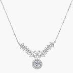 Elegant sterling silver necklace featuring intricate wing-like design with brilliant moissanite stones on neutral background.