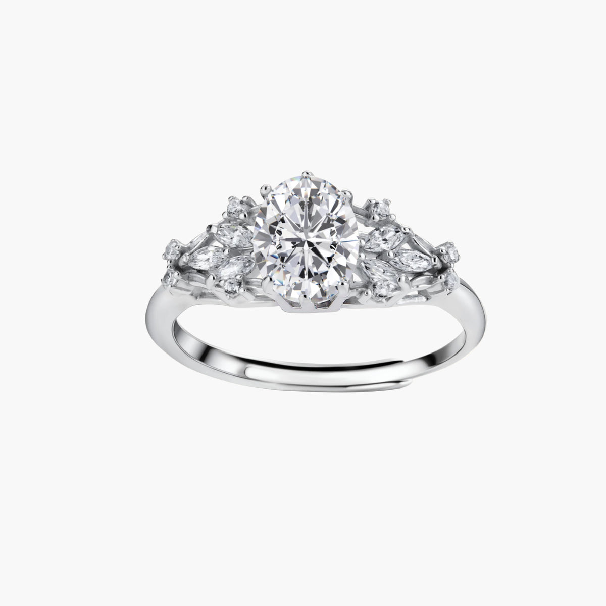 Sterling silver ring with oval moissanite center stone surrounded by smaller accent stones in ornate setting