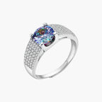 Sterling silver adjustable ring with brilliant round moissanite center stone and pavé diamond band showing rainbow fire