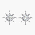 Sterling silver star-shaped stud earrings with brilliant moissanite center stones and pavé details on neutral background.
