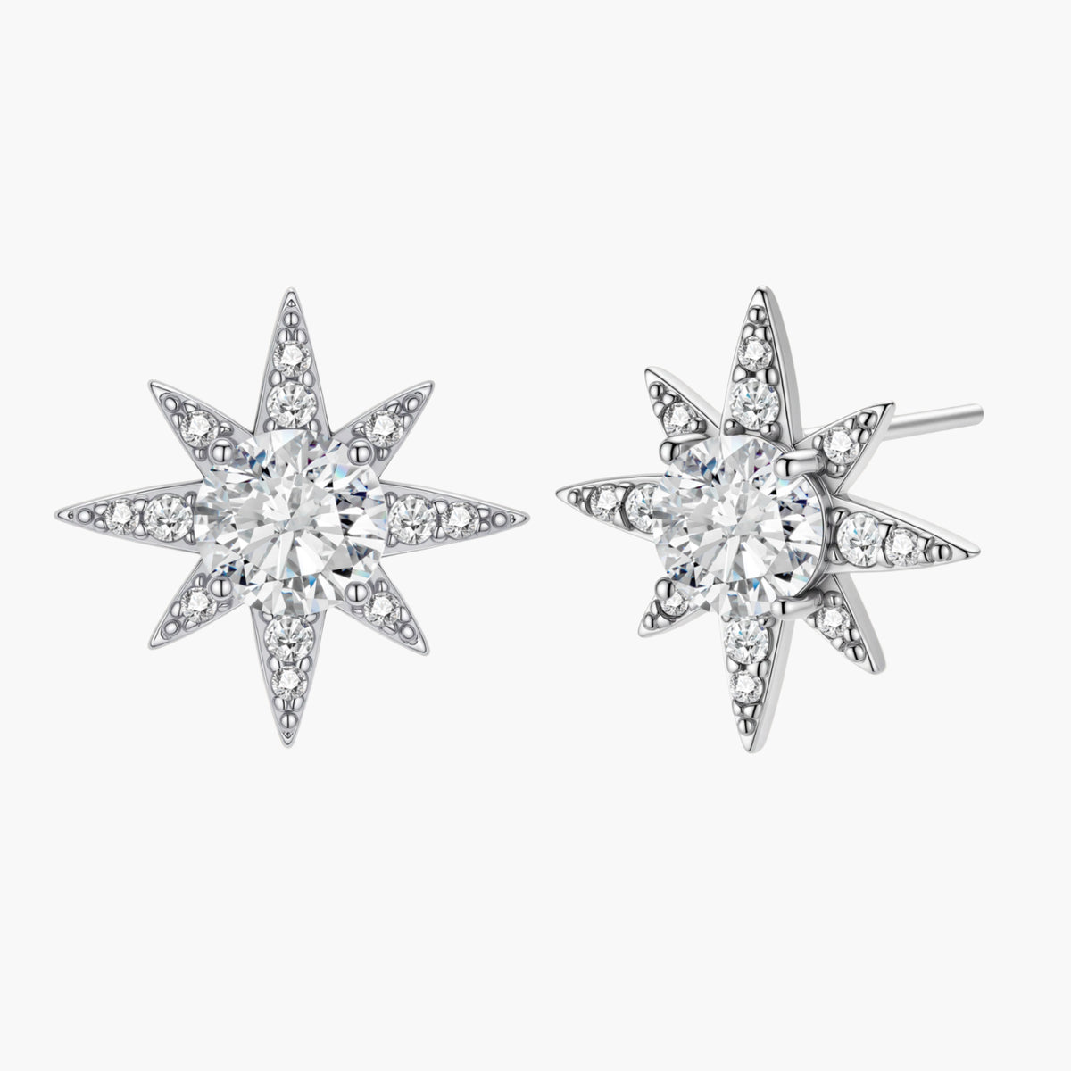 Sterling silver star-shaped stud earrings with brilliant moissanite center stones and pavé details on neutral background.