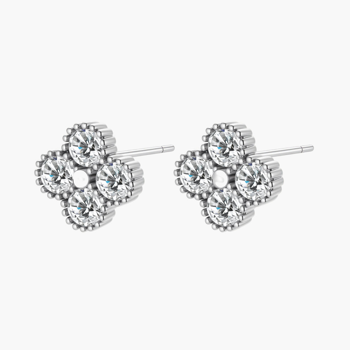 Dainty sterling silver quatrefoil stud earrings with four brilliant moissanite stones and center accent on white background.