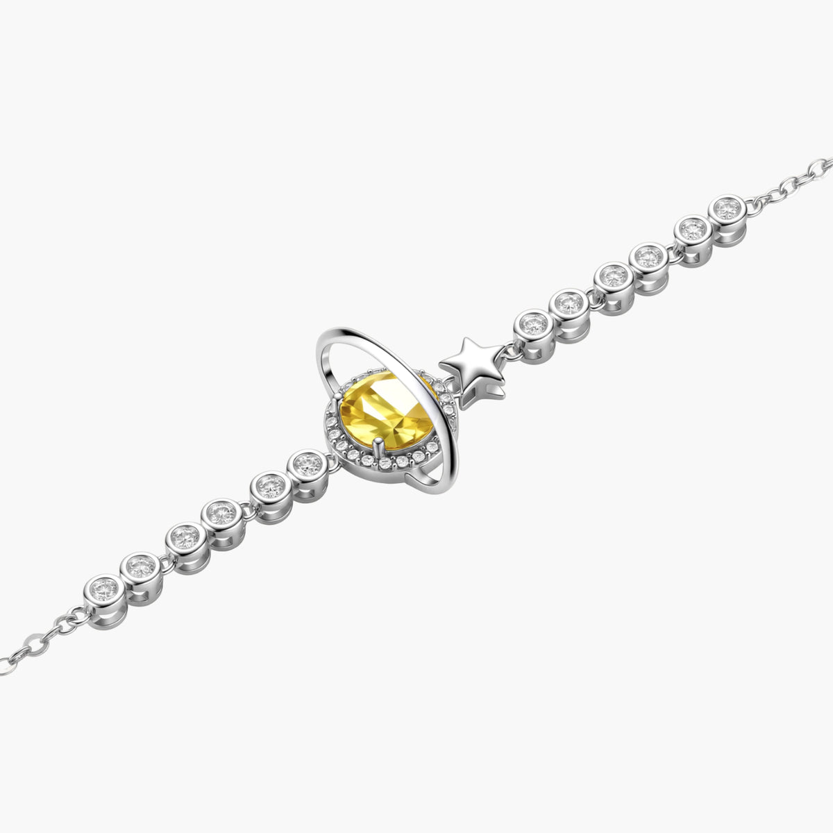 Sterling silver bracelet with yellow moissanite centerpiece in oval setting, crystal chain, and star charm on white background.