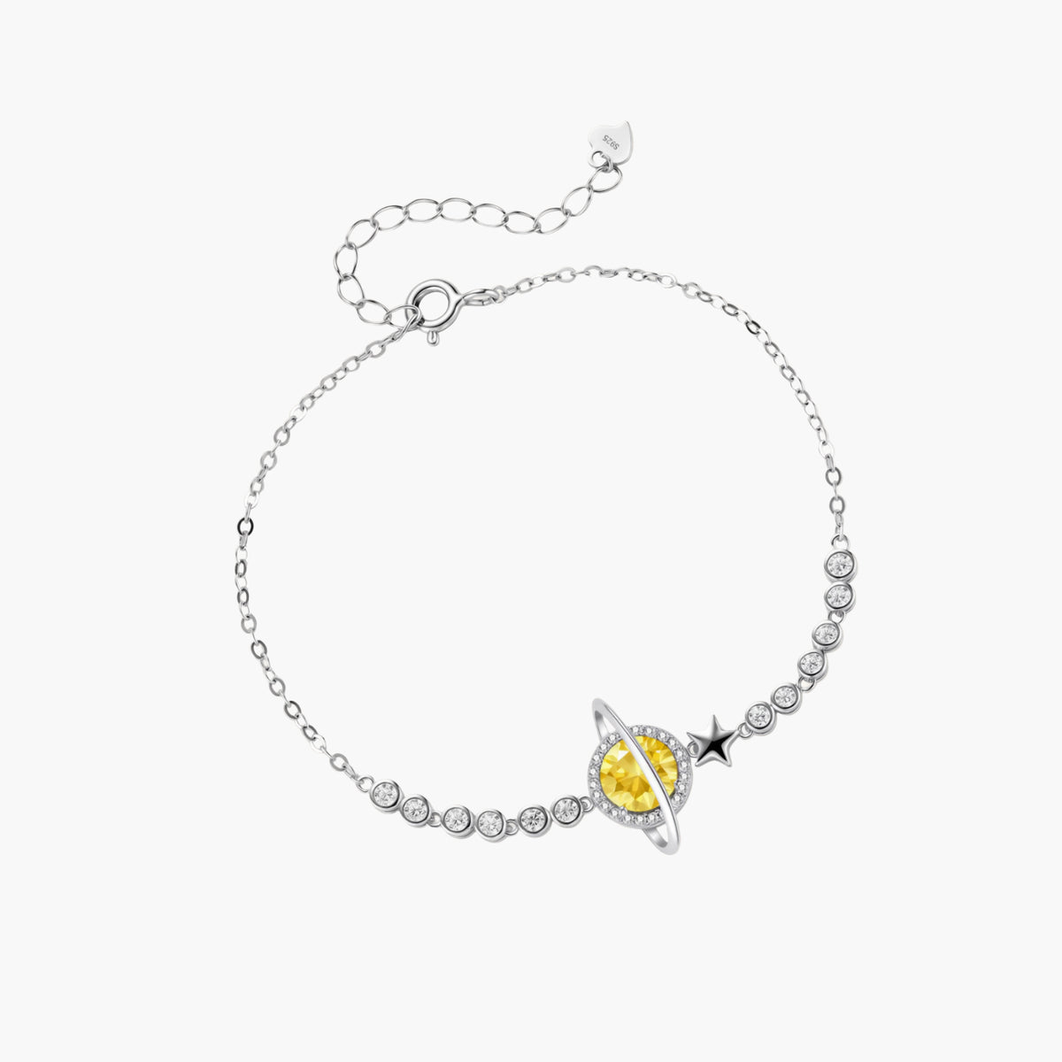 Sterling silver bracelet with yellow moissanite centerpiece in oval setting, crystal chain, and star charm on white background.