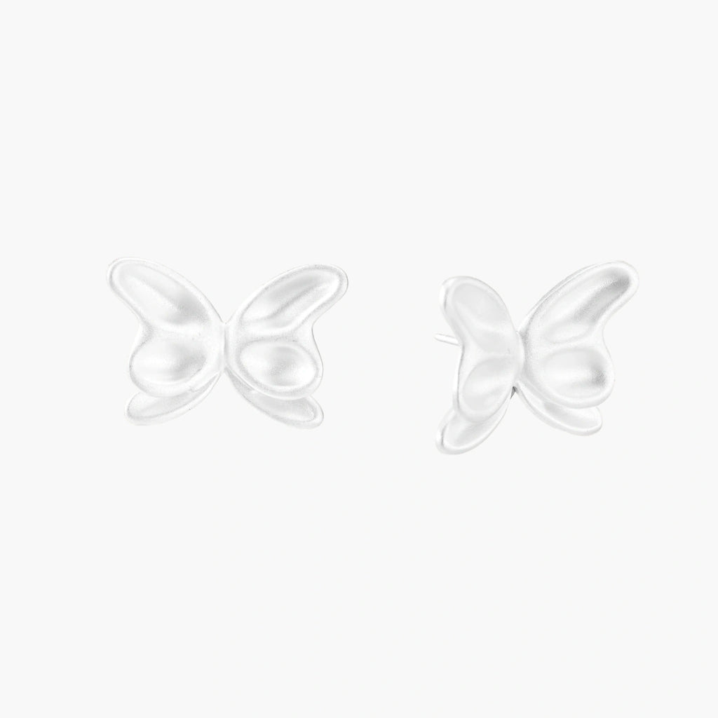 Pair of translucent butterfly-shaped stud earrings with frosted finish and dimensional wing details on white background