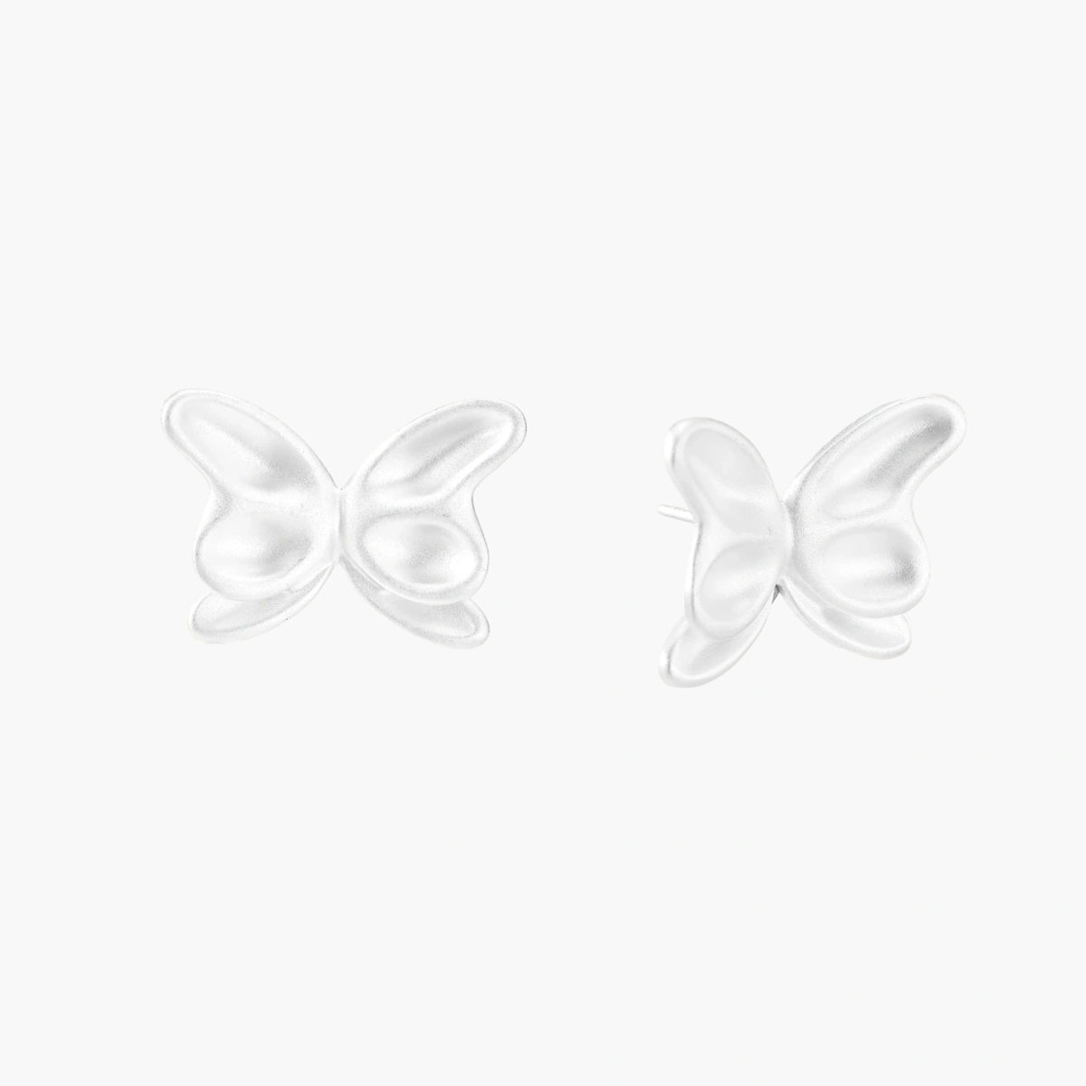 Pair of translucent butterfly-shaped stud earrings with frosted finish and dimensional wing details on white background