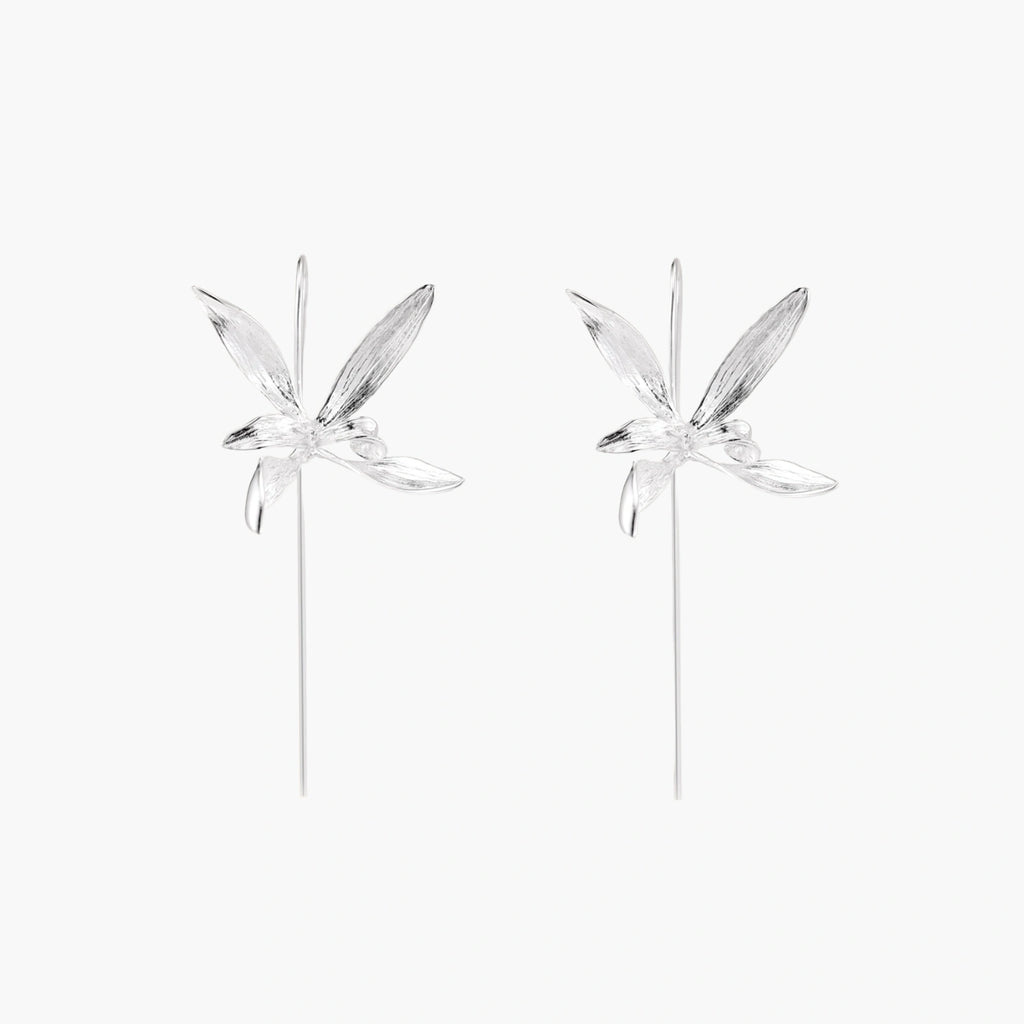 Delicate sterling silver dragonfly earrings with textured wings and curved threader hooks on white background